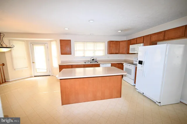 a view of n empty room with a window