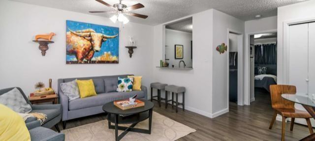 1915 Fairlawn Lane, Unit 2 Austin, TX 78704 - Photo 3 of 12 Living room with ceiling fan, wood finished floors, and a textured ceiling