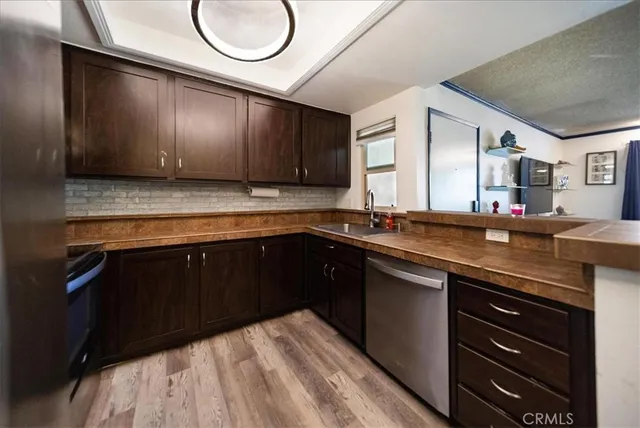 a kitchen with a sink and a stove