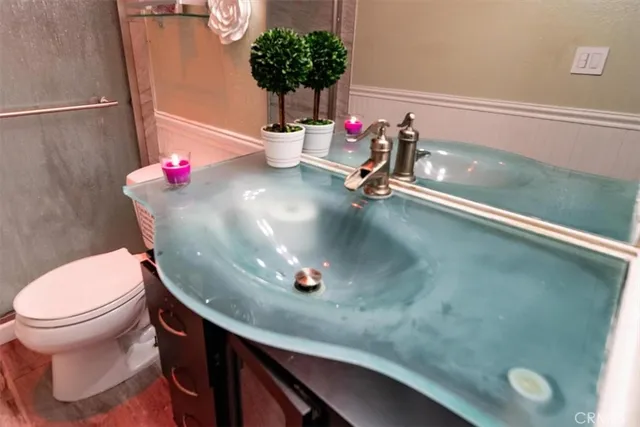 a bathroom with a sink and a toilet