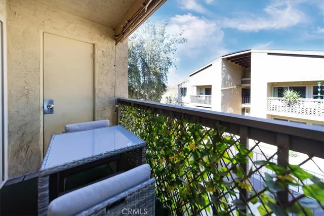 a balcony view with a garden space