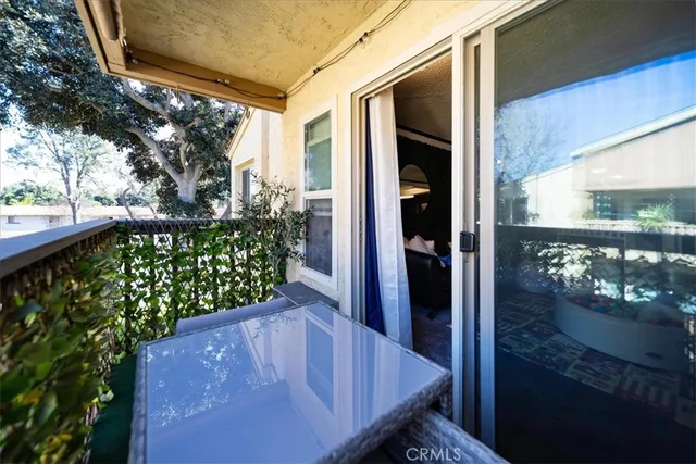 a backyard of a house with table and chairs
