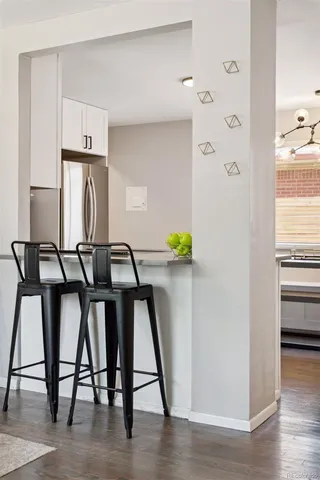 a view of workspace with furniture and wooden floor