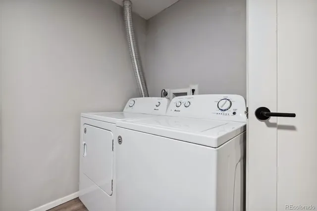 a bathroom with a sink a mirror a toilet and shower