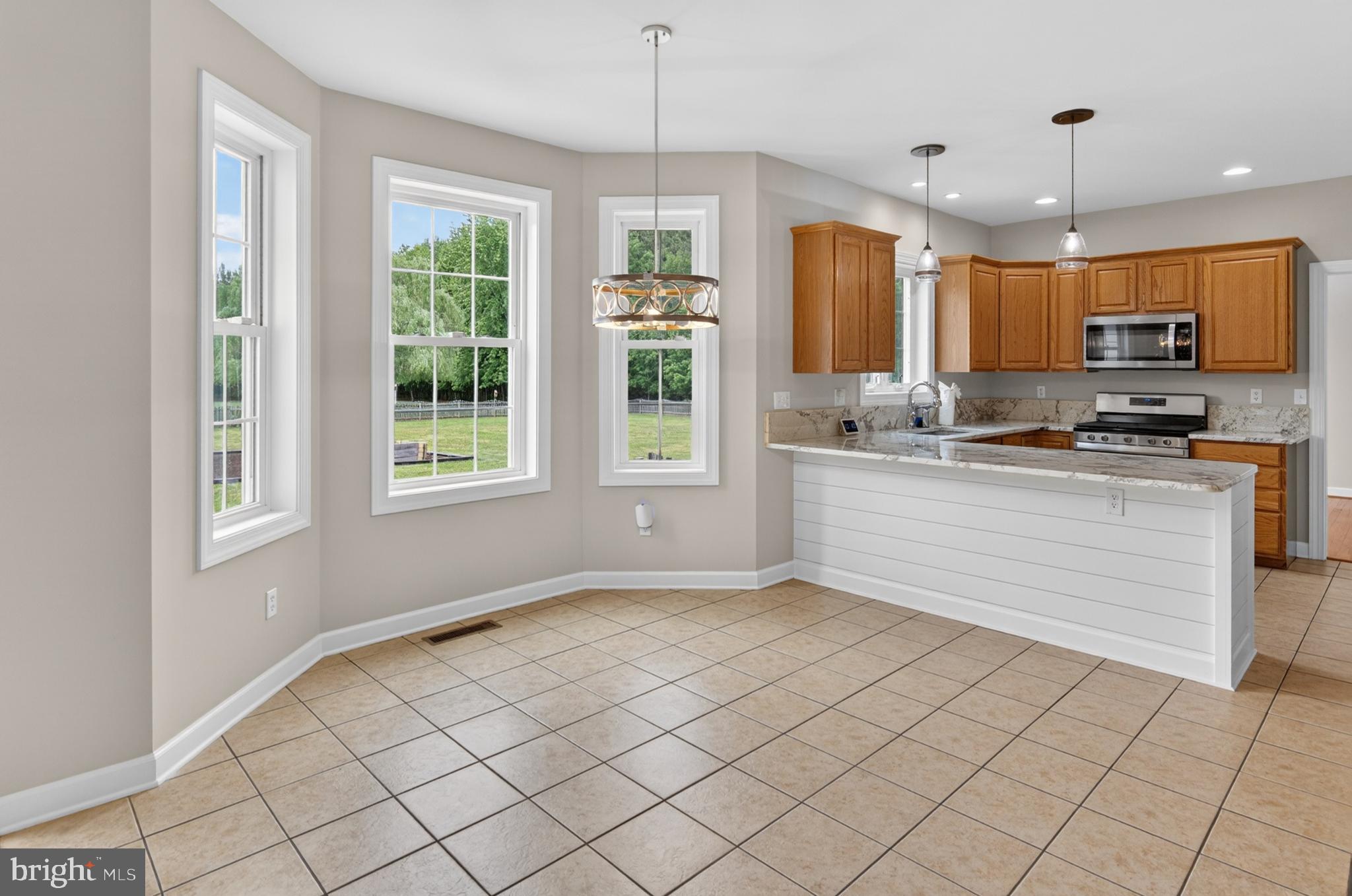 337 Roe Ingleside Road Centreville, MD 21617 - Photo 28 of 56 a kitchen with a stove a sink and a window