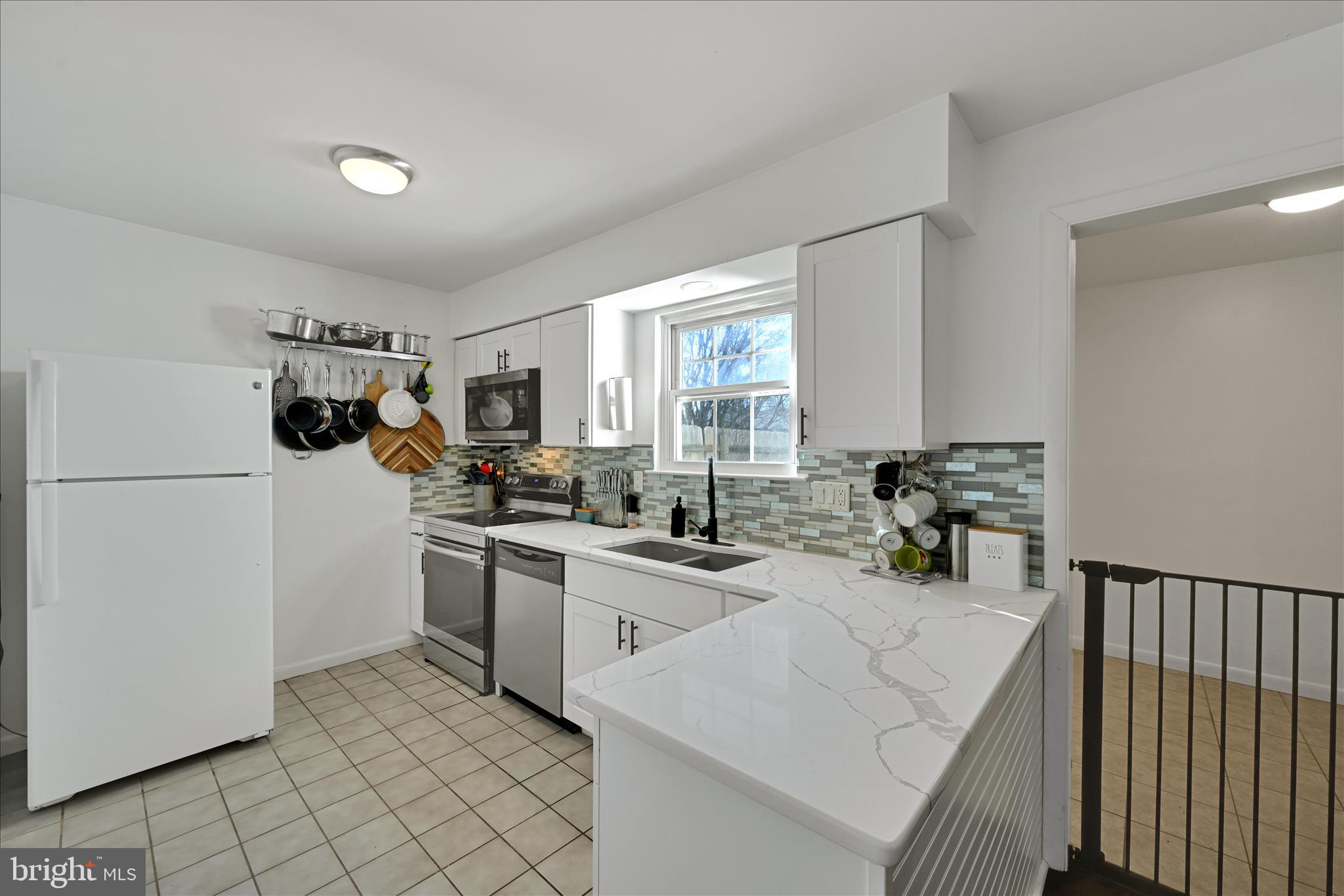 1053 Williamsburg Road Lancaster, PA 17603 - Photo 15 of 33 a kitchen with a sink dishwasher stove and refrigerator