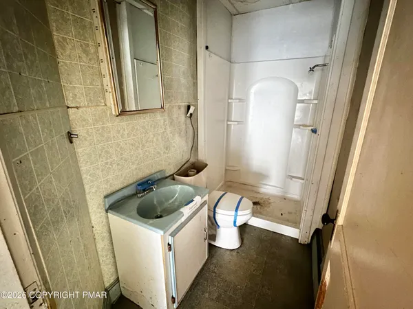 a view of an empty room with a fireplace