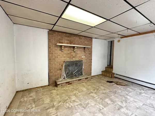 a bathroom with a tub sink and toilet