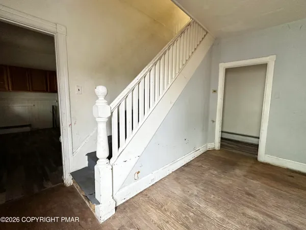 a bathroom with a sink mirror vanity and toilet