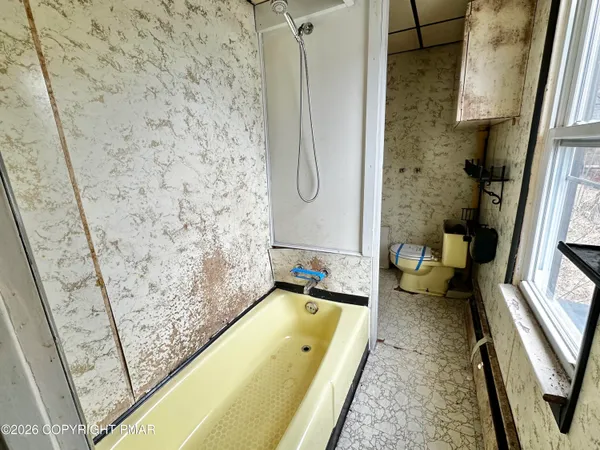 an empty room with a empty space and a window