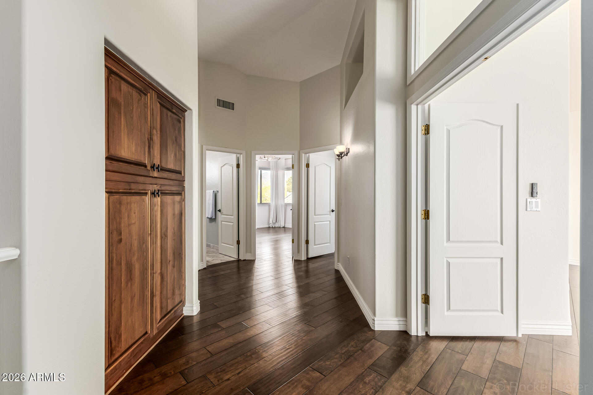 9719 East Pine Valley Road Scottsdale, AZ 85260 - Photo 28 of 62 a view of a hallway with wooden floor
