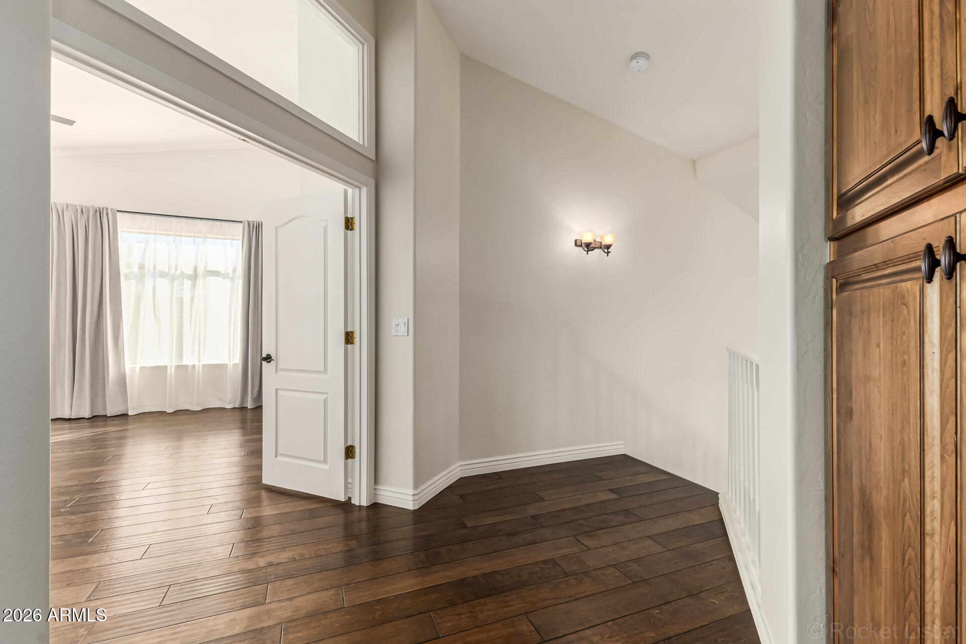 9719 East Pine Valley Road Scottsdale, AZ 85260 - Photo 29 of 62 a view of a hallway with wooden floor
