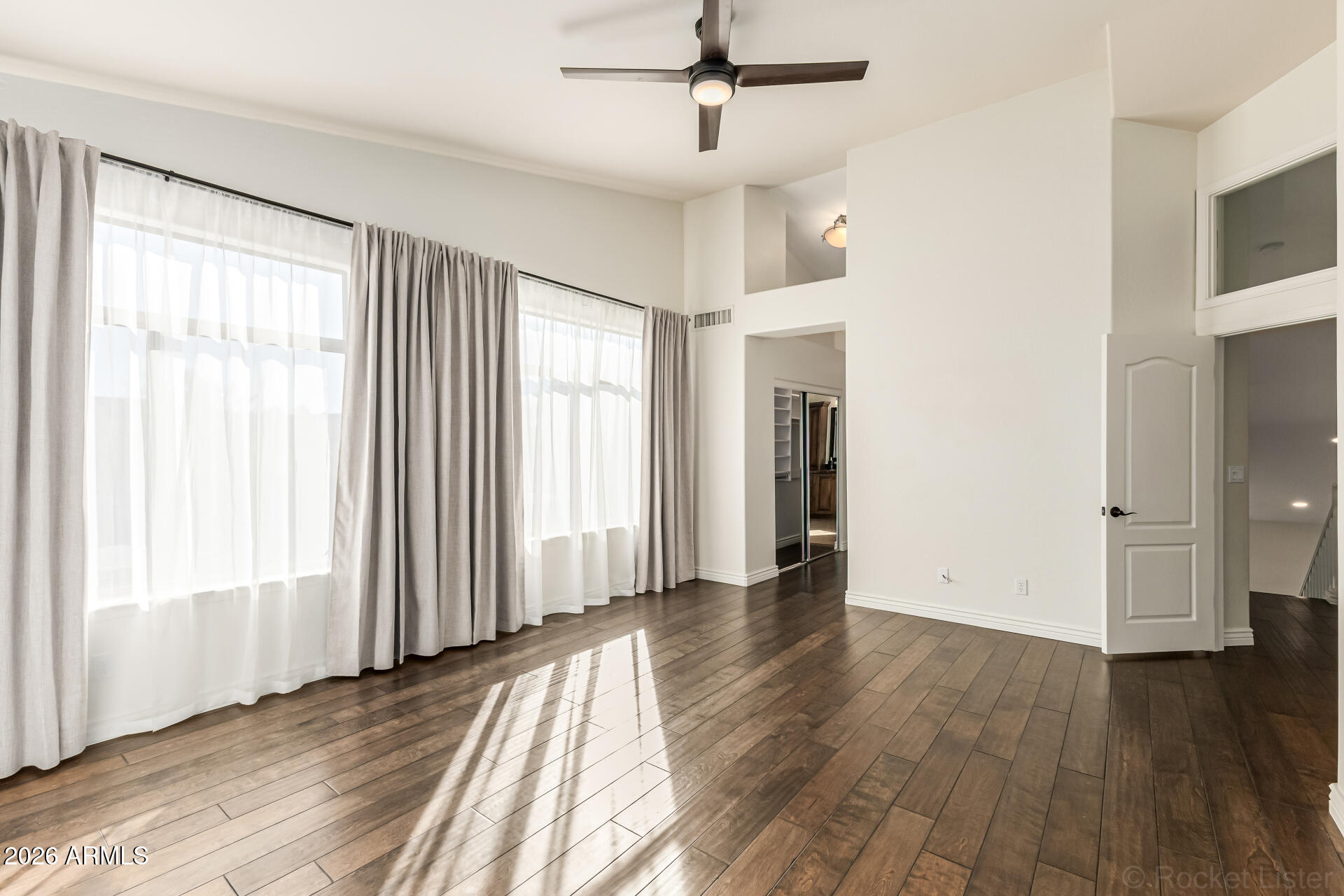 9719 East Pine Valley Road Scottsdale, AZ 85260 - Photo 32 of 62 wooden floor in an empty room with a window
