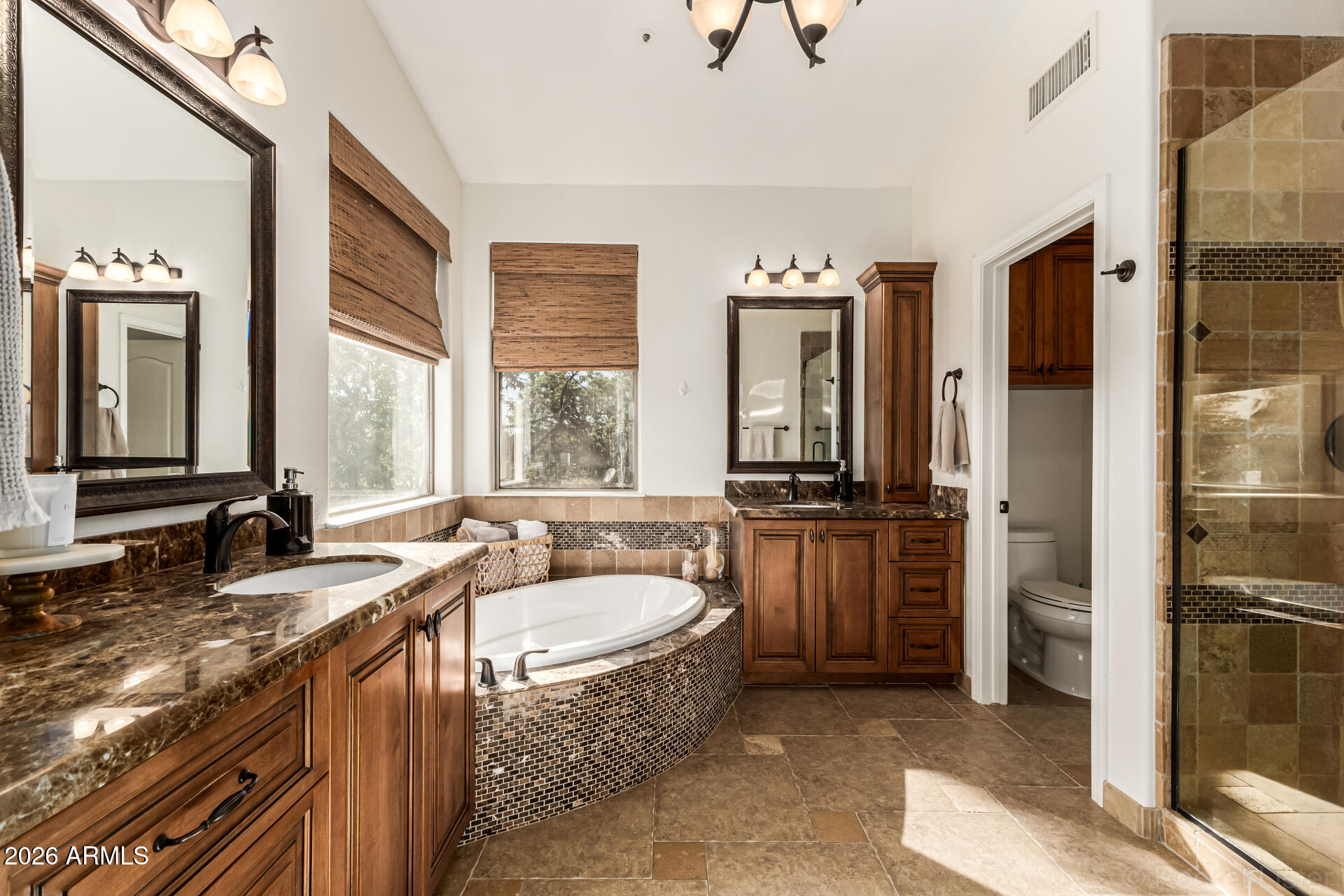 9719 East Pine Valley Road Scottsdale, AZ 85260 - Photo 33 of 62 a bathroom with a granite countertop tub sink and mirror