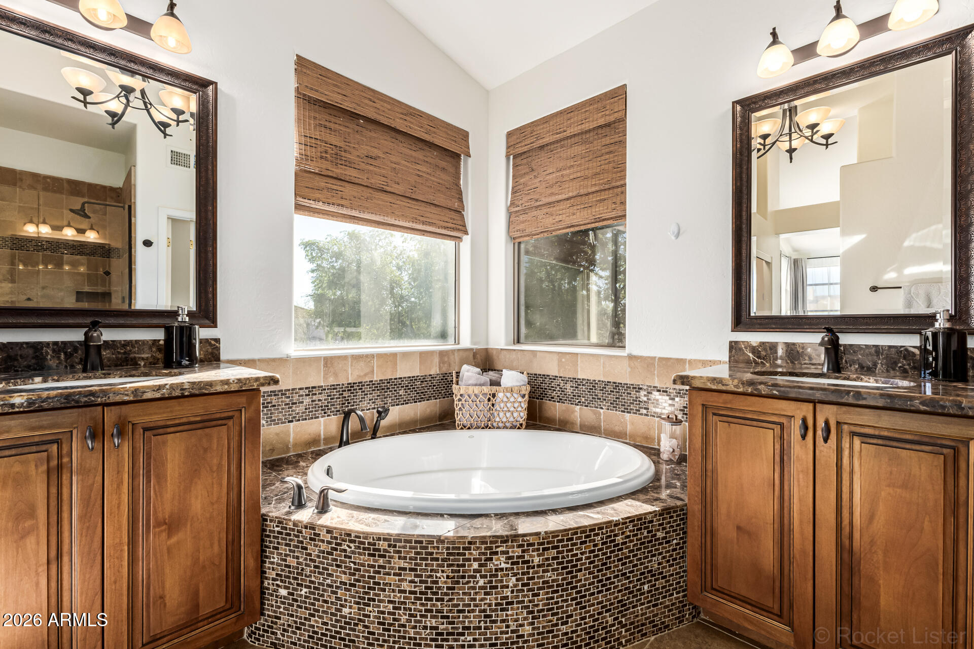 9719 East Pine Valley Road Scottsdale, AZ 85260 - Photo 35 of 62 a bathroom with a granite countertop sink and a mirror
