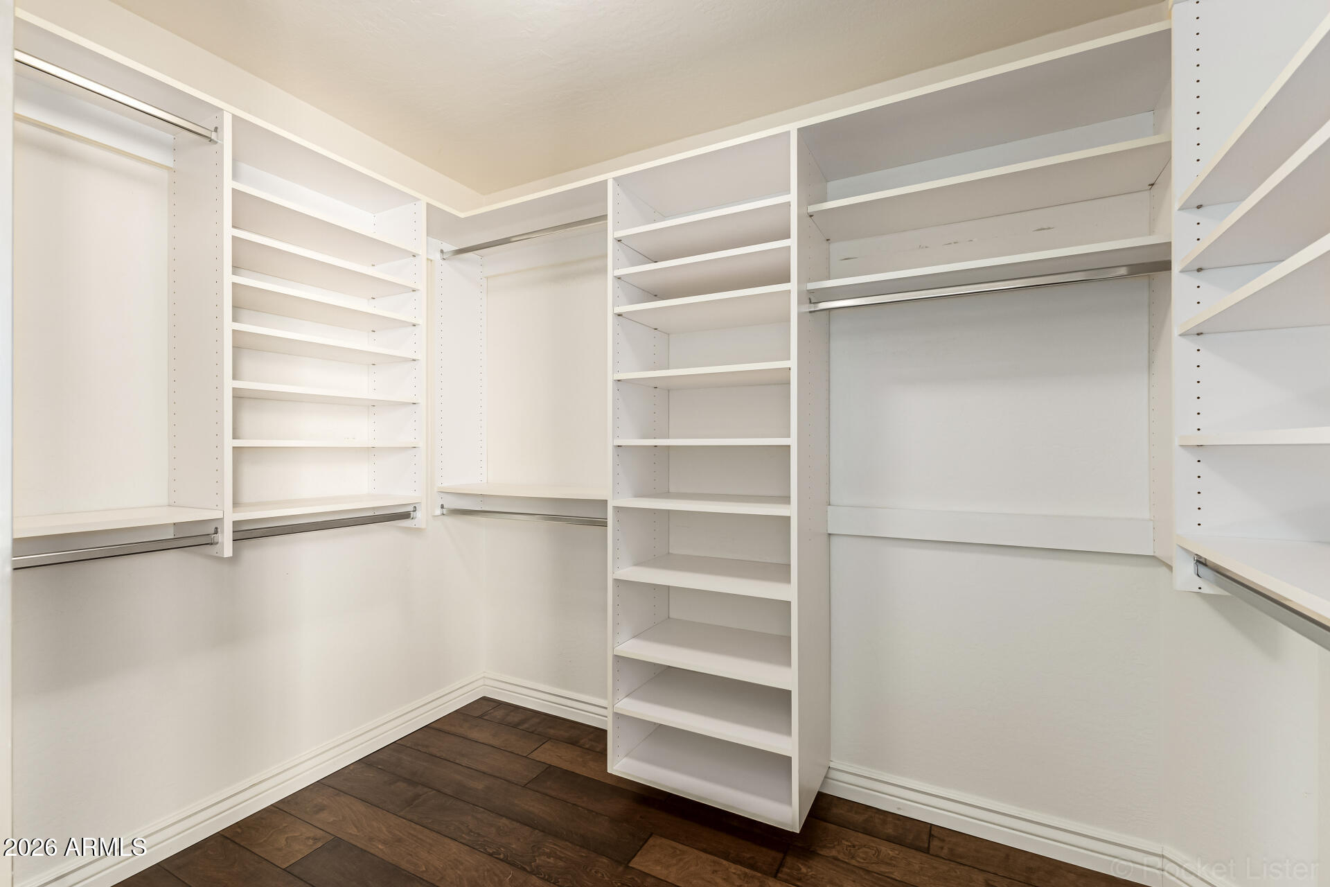 9719 East Pine Valley Road Scottsdale, AZ 85260 - Photo 37 of 62 a view of walk in closet with empty racks