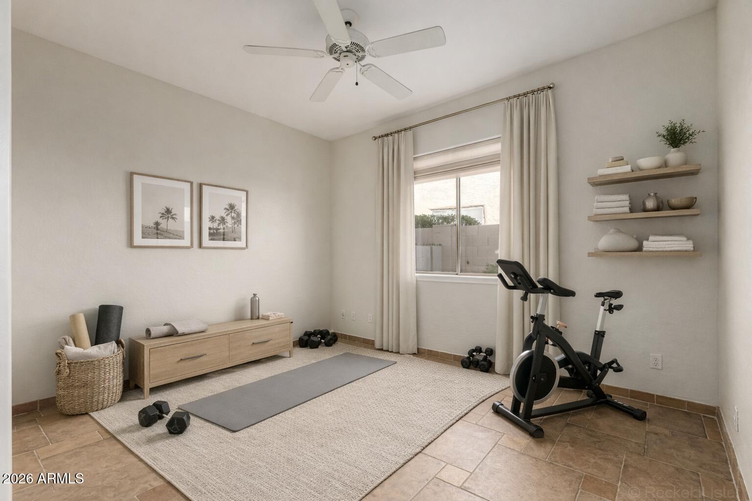 9719 East Pine Valley Road Scottsdale, AZ 85260 - Photo 40 of 62 a room with gym equipment and a window