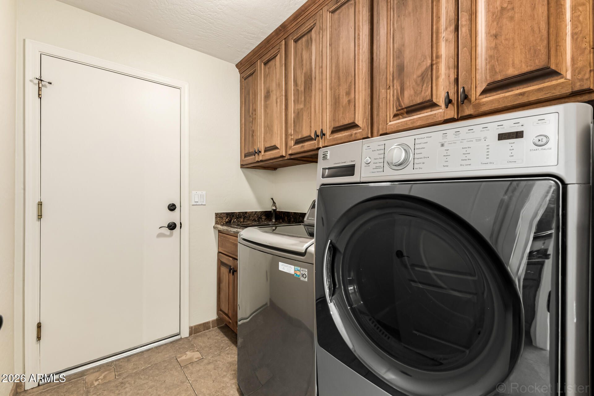 9719 East Pine Valley Road Scottsdale, AZ 85260 - Photo 50 of 62 a close view of a washer and dryer
