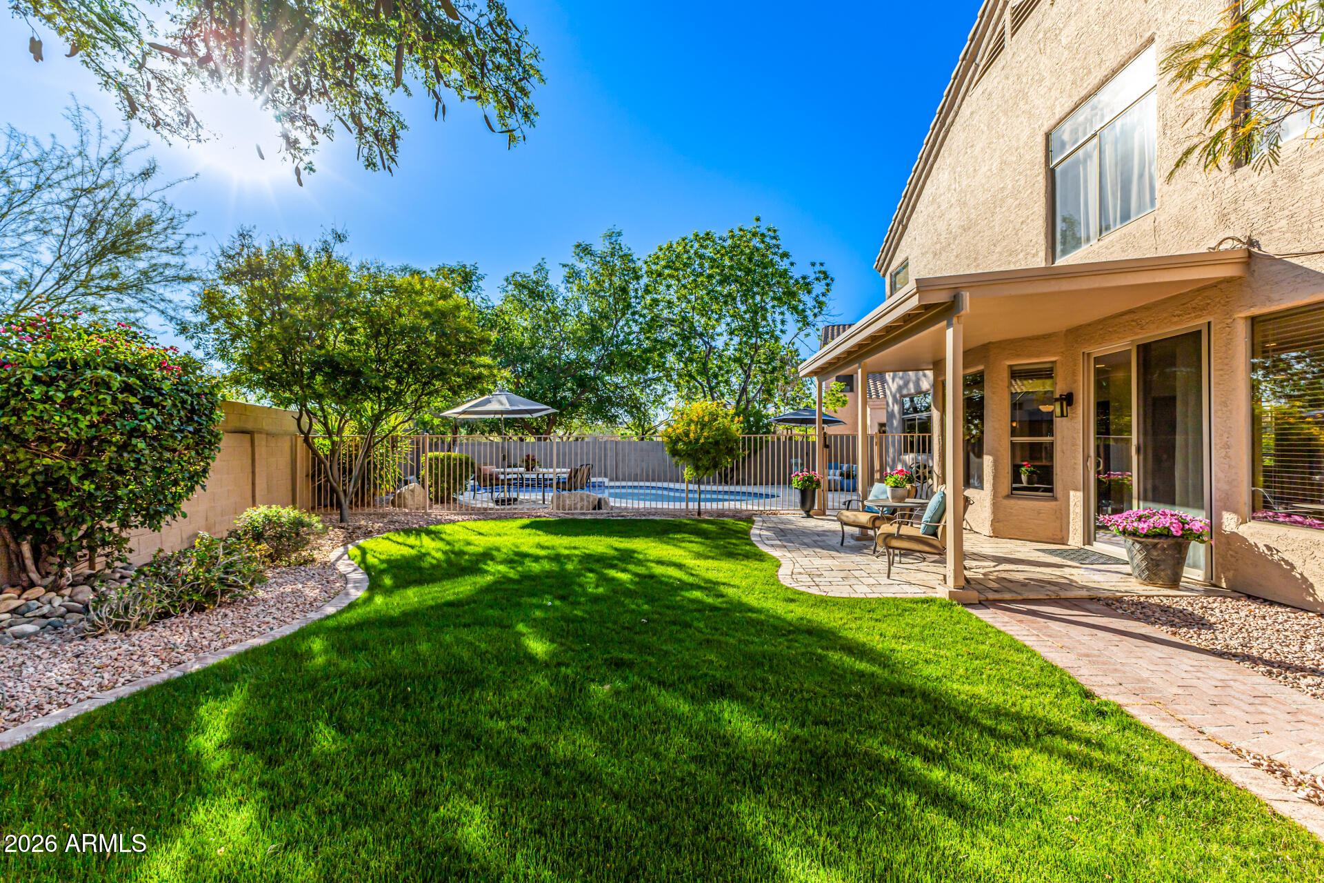 9719 East Pine Valley Road Scottsdale, AZ 85260 - Photo 54 of 62 a view of a chair and table in backyard of the house