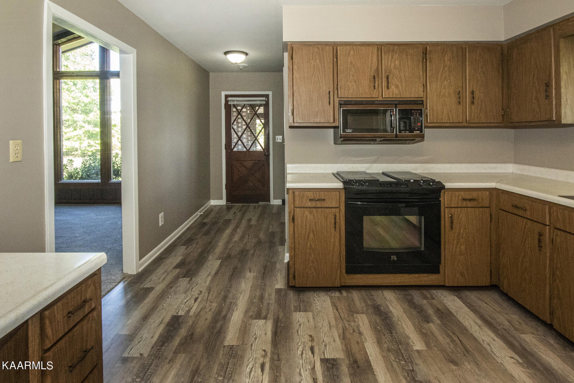 431 Sunnyside Road Sweetwater, TN 37874 - Photo 15 of 47 a kitchen with granite countertop a stove top oven and sink