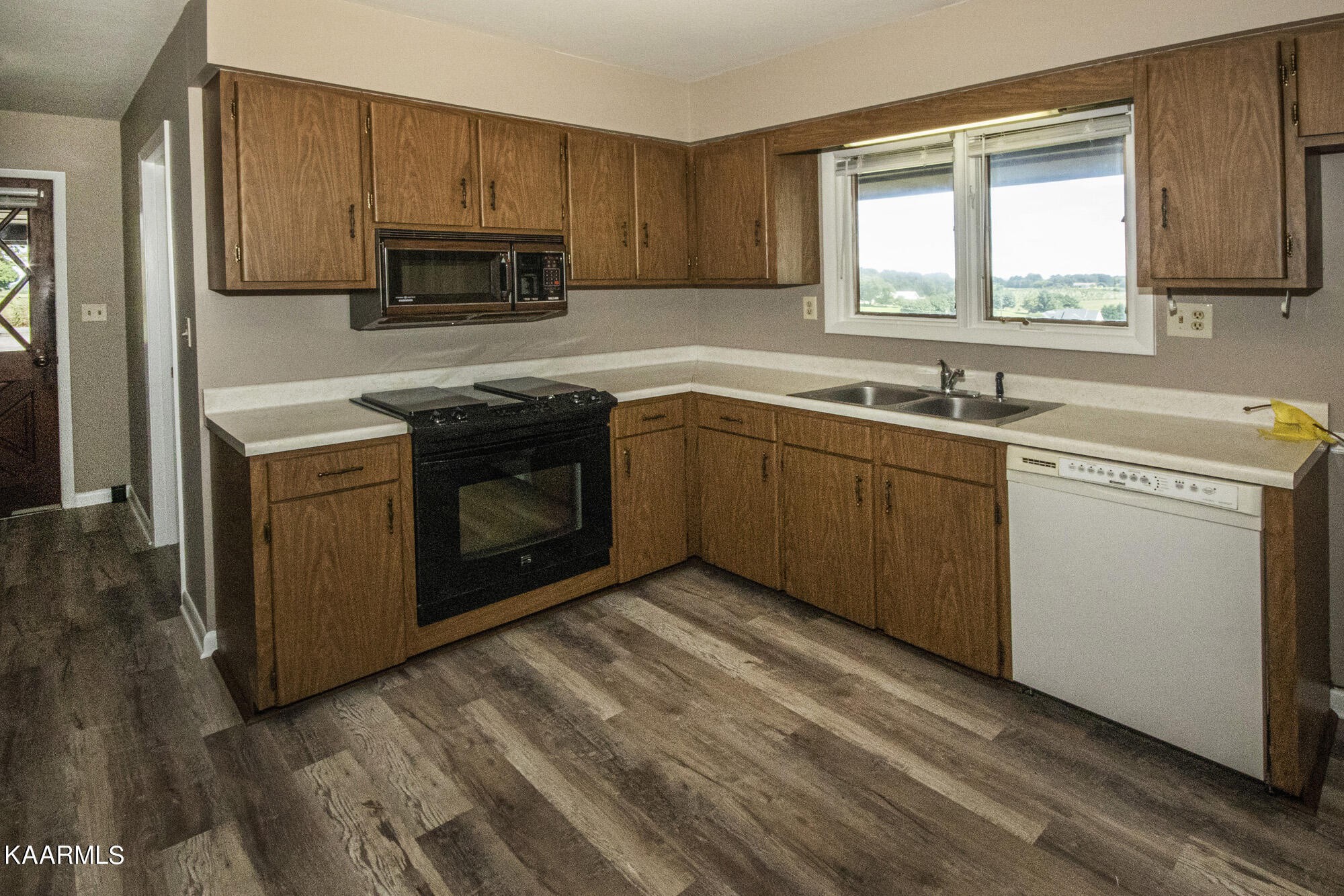 431 Sunnyside Road Sweetwater, TN 37874 - Photo 16 of 47 a kitchen with a sink stove and microwave