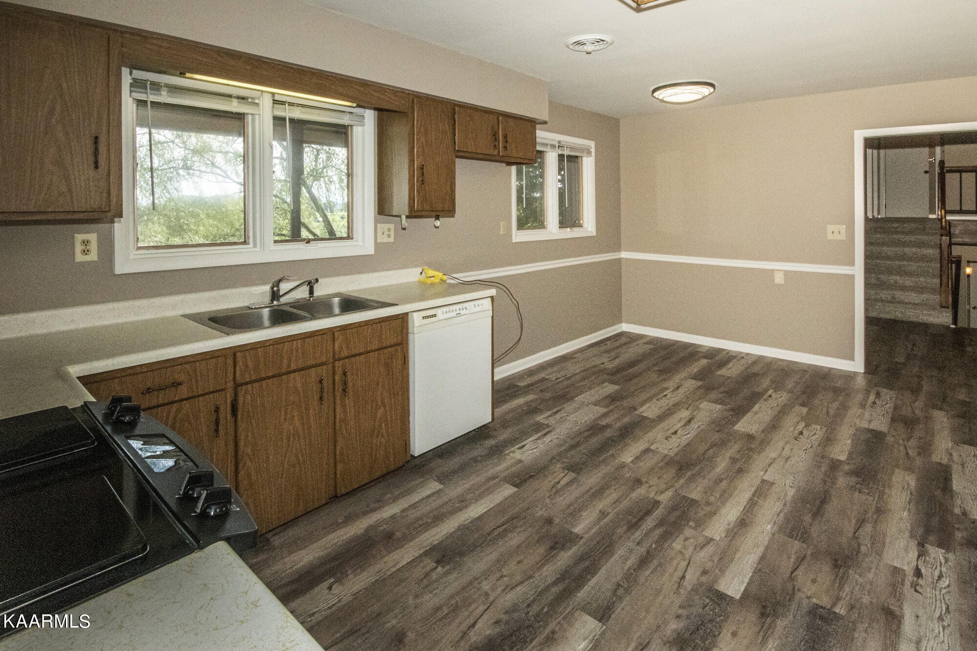 431 Sunnyside Road Sweetwater, TN 37874 - Photo 17 of 47 a view of a kitchen with wooden floor and electronic appliances