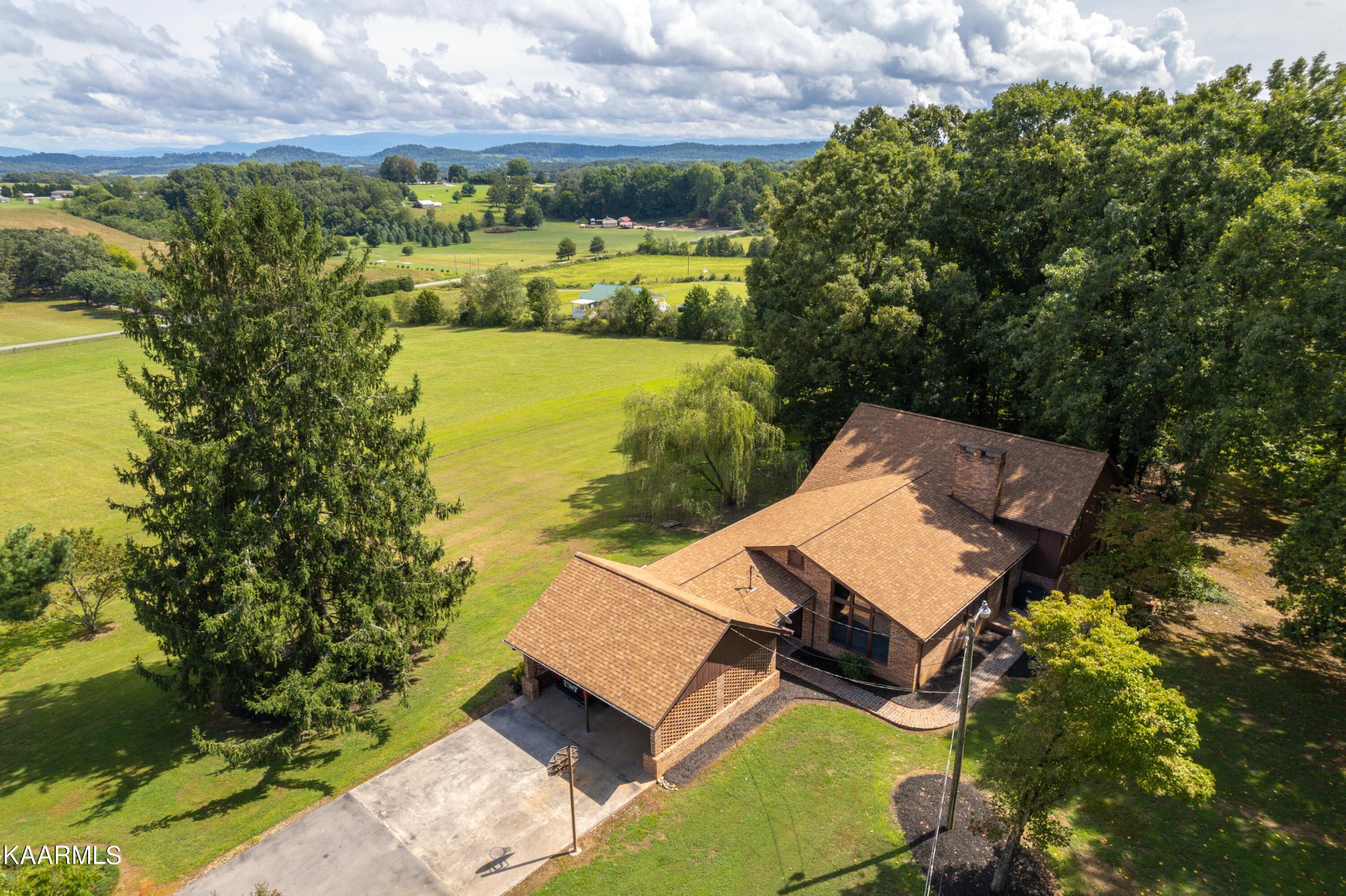 431 Sunnyside Road Sweetwater, TN 37874 - Photo 2 of 47 an aerial view of a house with a yard basket ball court and outdoor seating