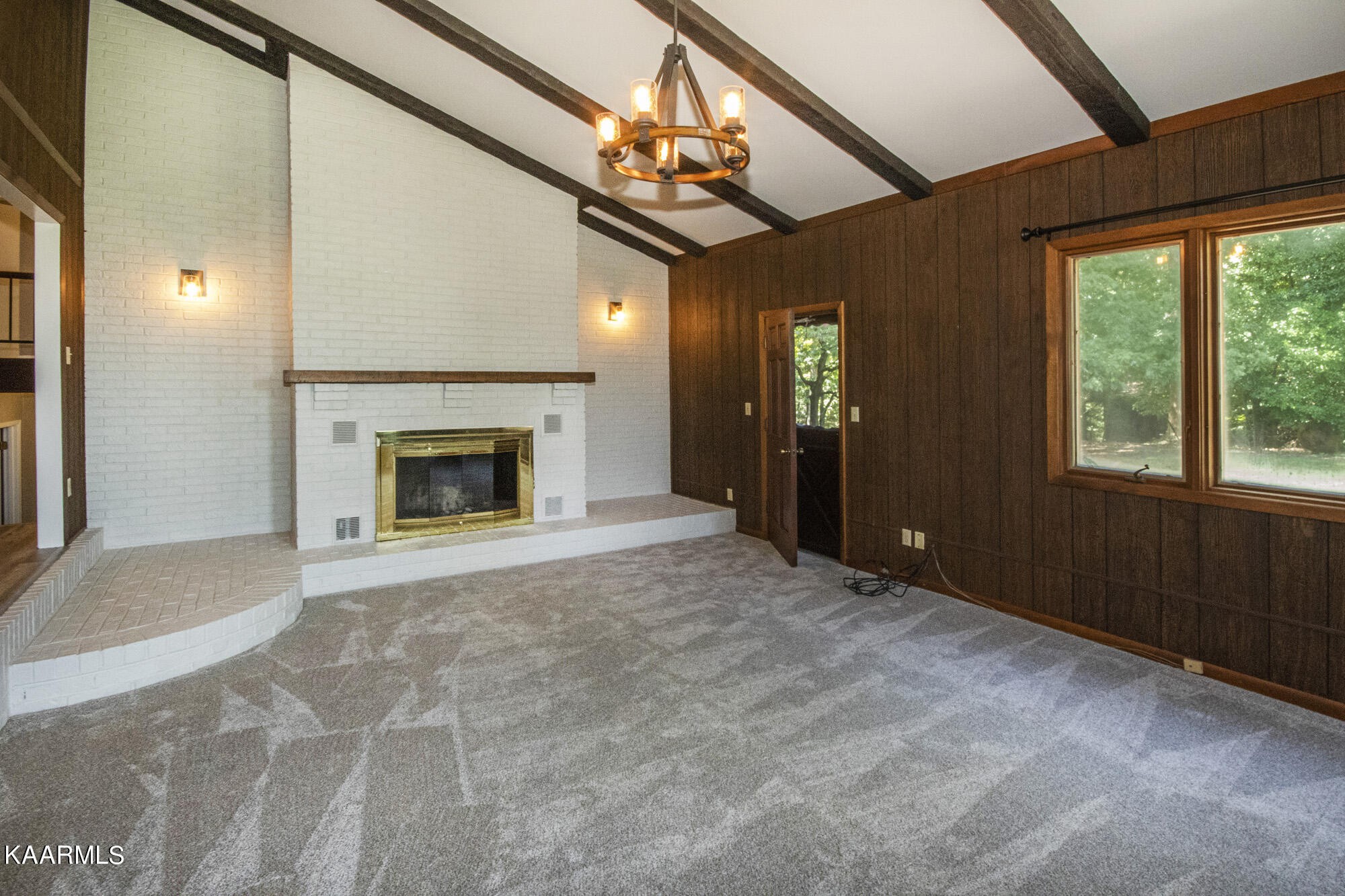 431 Sunnyside Road Sweetwater, TN 37874 - Photo 8 of 47 a view of an empty room with a fireplace and a window