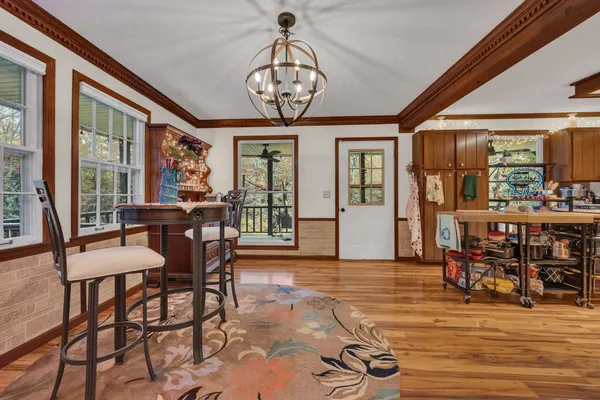 a view of a dining room with furniture window and wooden floor