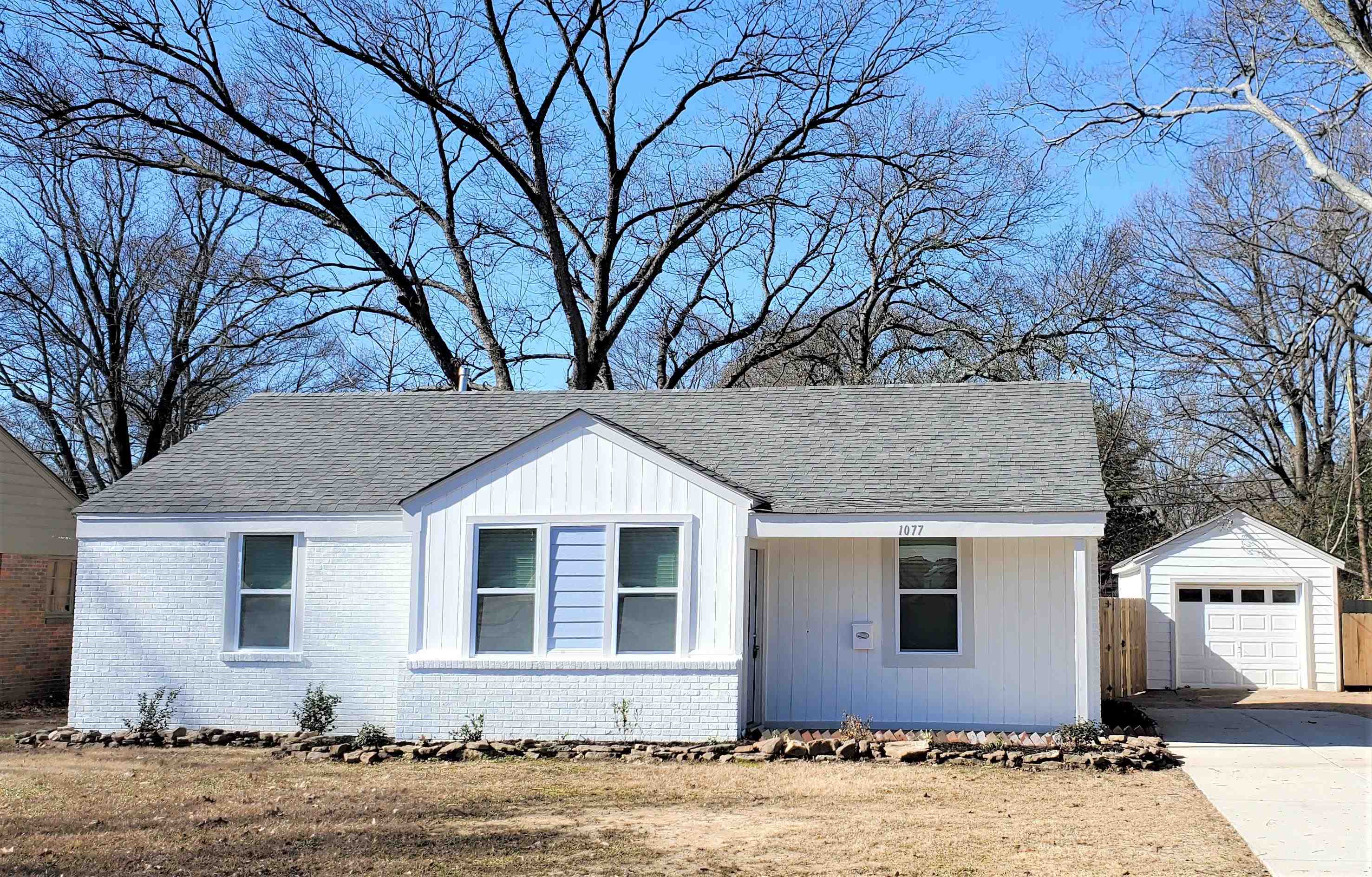 1077 Colonial Road Memphis, TN 38117 - Photo 1 of 20 a front view of a house with a yard