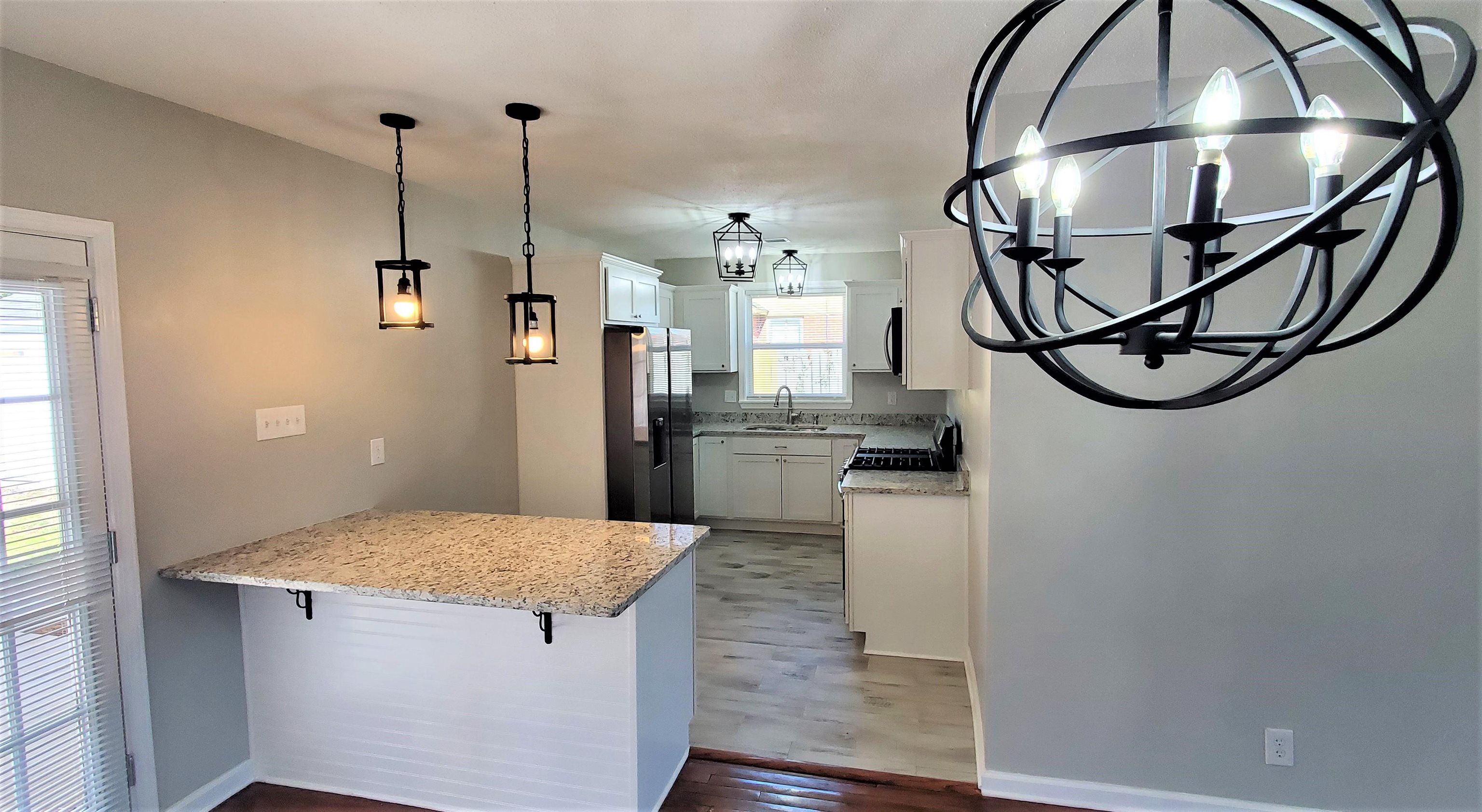1077 Colonial Road Memphis, TN 38117 - Photo 5 of 20 a kitchen with stainless steel appliances granite countertop a refrigerator a oven a sink and dishwasher