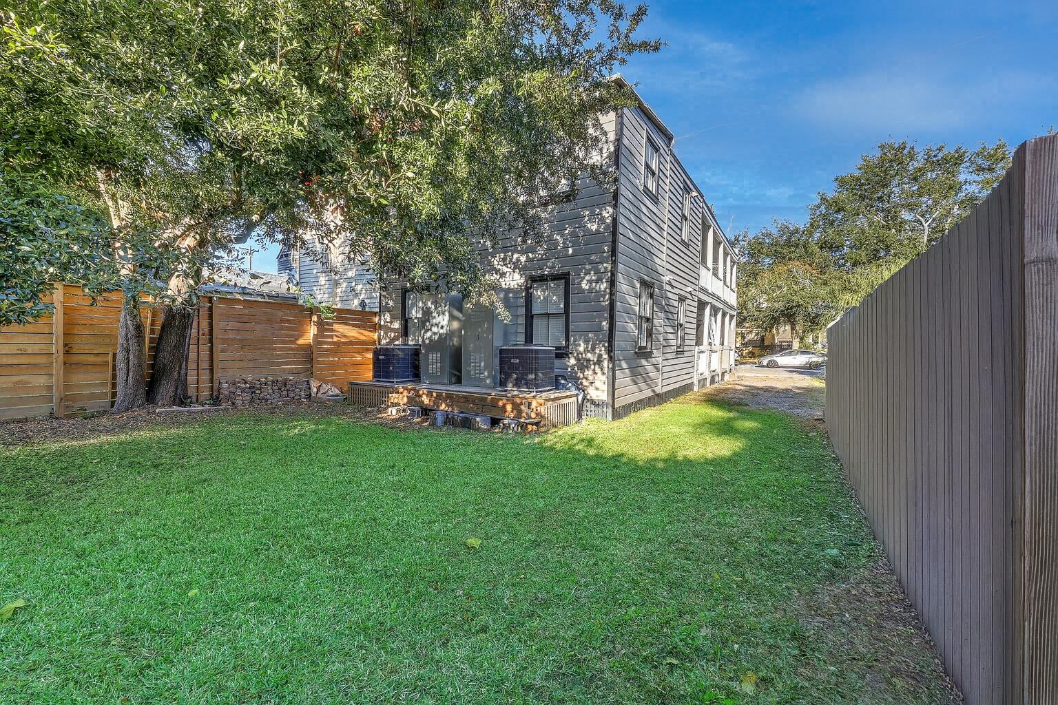 19 America Street, Unit A AND B Charleston, SC 29403 - Photo 38 of 45 Backyard Serenity with Green Lawn