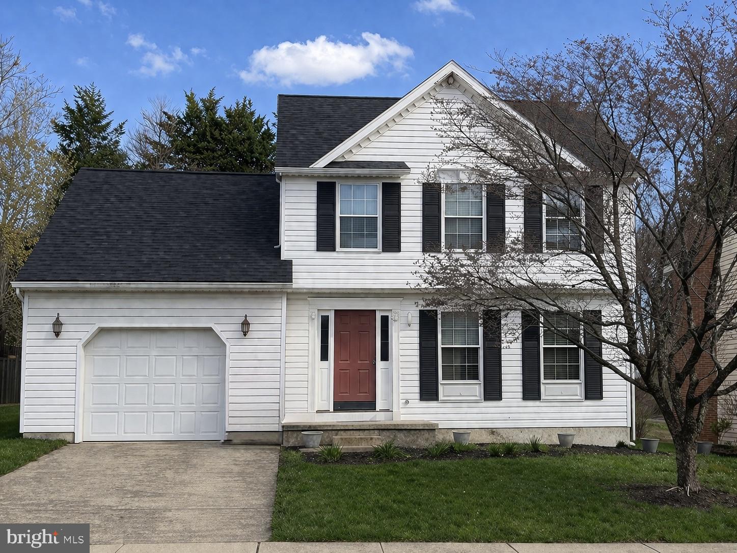 front view of a house with a yard