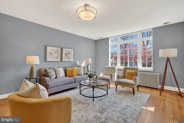 a living room with furniture and a window