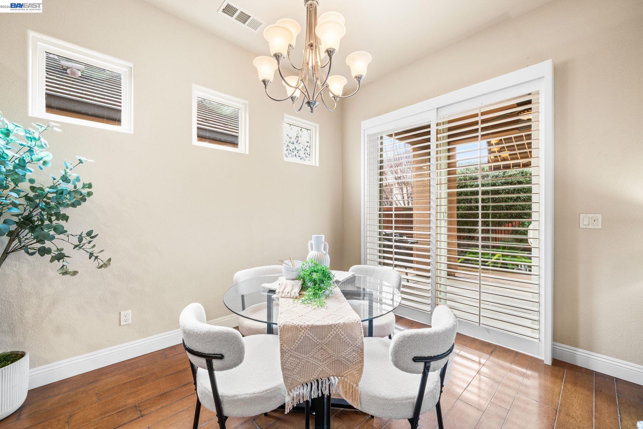 1033 Malbec Lane Brentwood, CA 94513 - Photo 14 of 37 a dining room with furniture and wooden floor