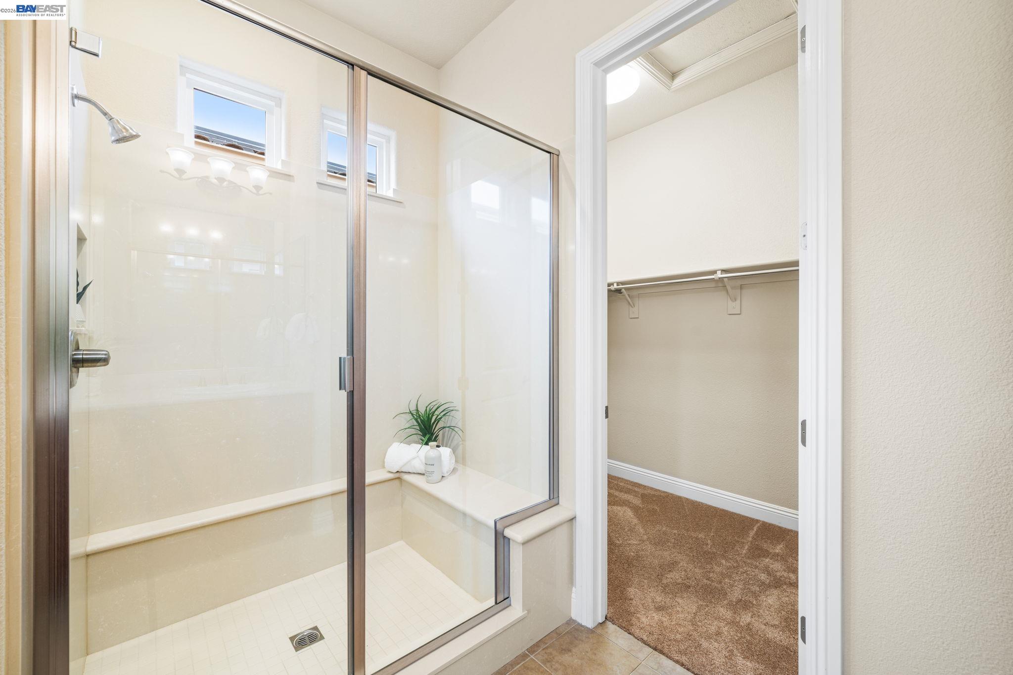 1033 Malbec Lane Brentwood, CA 94513 - Photo 26 of 37 a bathroom with a shower and a glass door