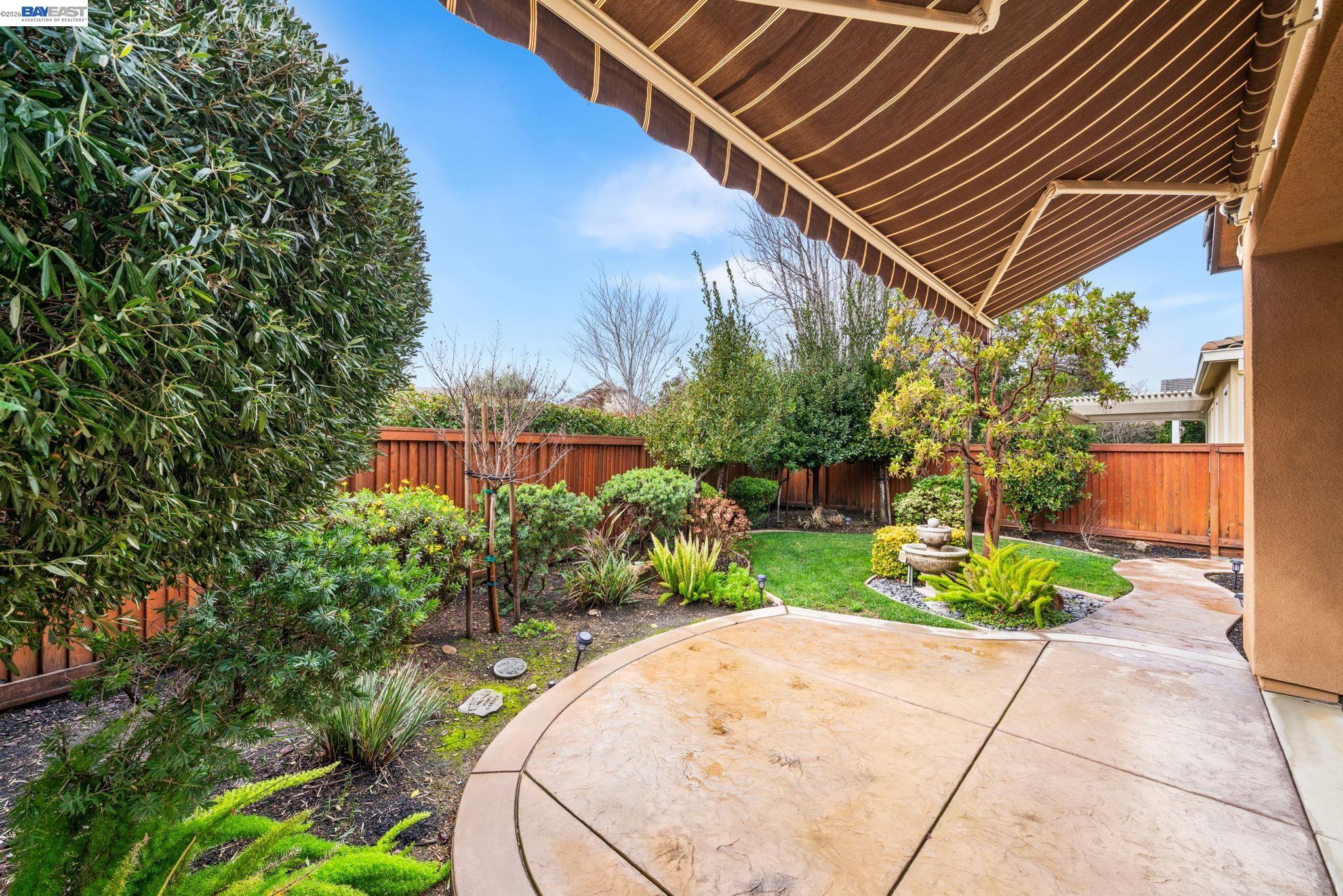 1033 Malbec Lane Brentwood, CA 94513 - Photo 33 of 37 a backyard of a house with a garden and plants