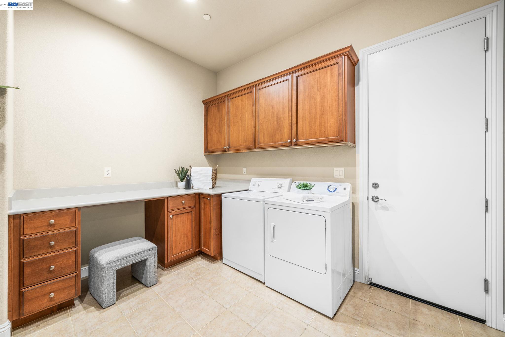 1033 Malbec Lane Brentwood, CA 94513 - Photo 8 of 37 a utility room with cabinets washer and dryer