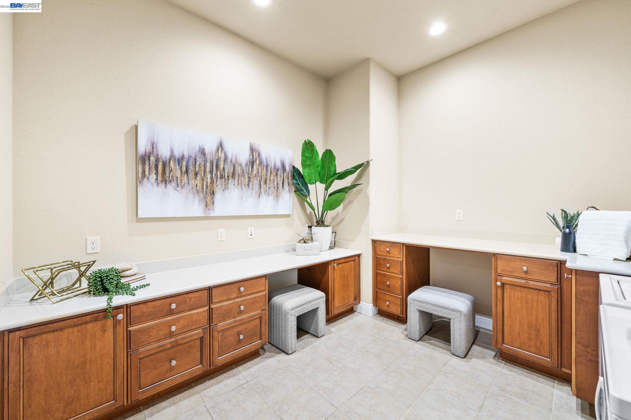 1033 Malbec Lane Brentwood, CA 94513 - Photo 9 of 37 a spacious bathroom with a double vanity sink and a potted plant