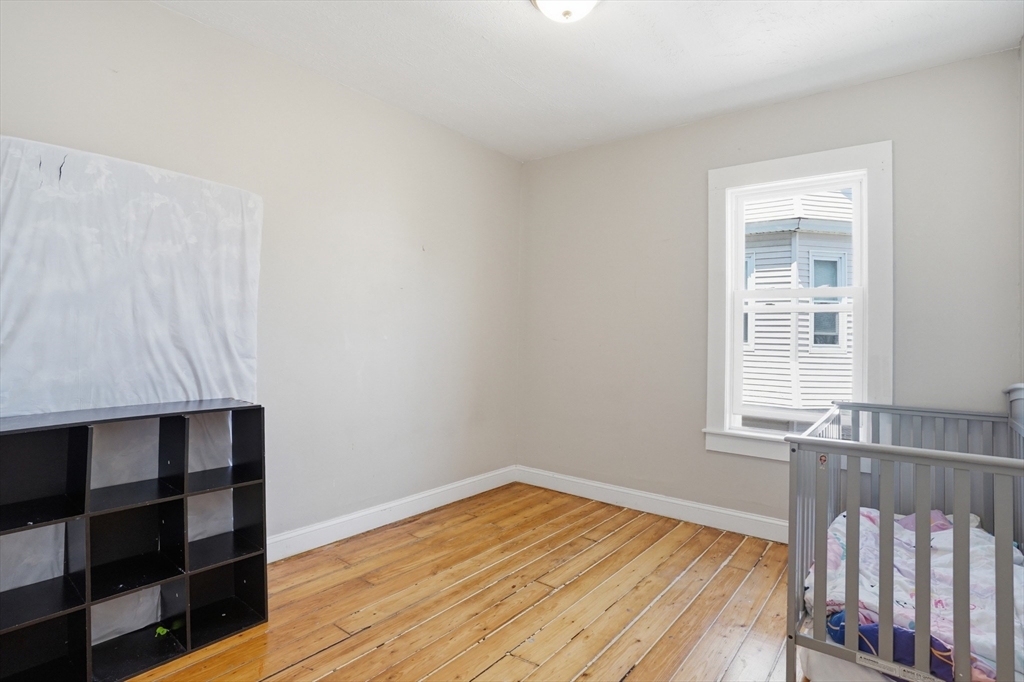 196 Irving Street Fall River, MA 02723 - Photo 22 of 34 a view of a room with wooden floor and cabinet