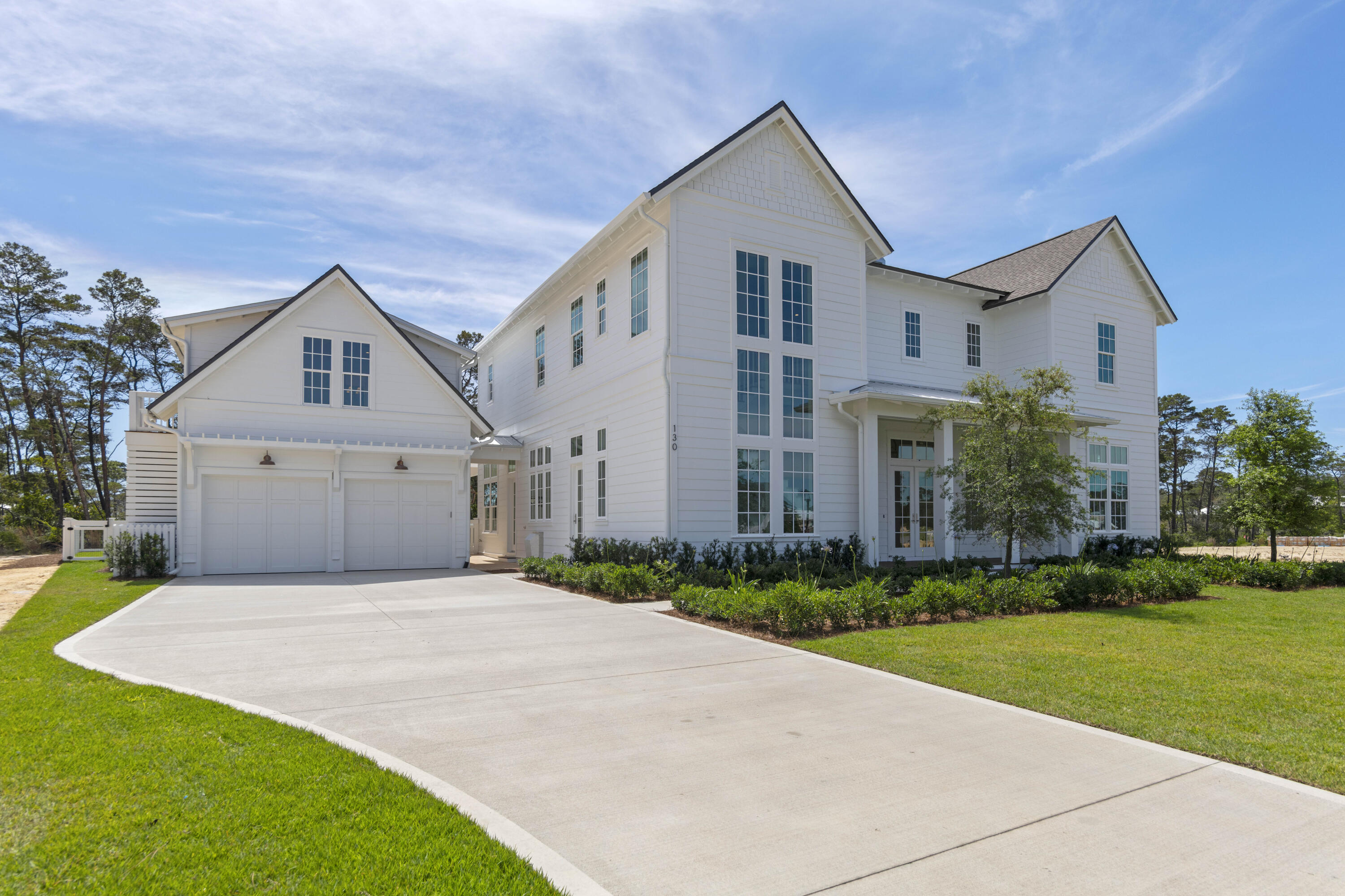 130 East Elliot Way Watersound, FL 32461 - Photo 1 of 52 a front view of house with yard and green space
