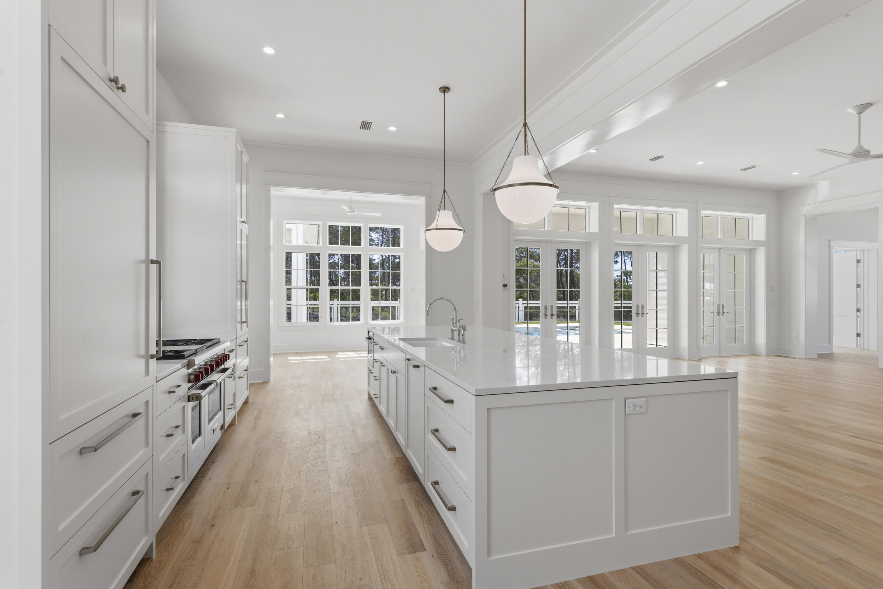 130 East Elliot Way Watersound, FL 32461 - Photo 11 of 52 a kitchen with counter top space and wooden floor