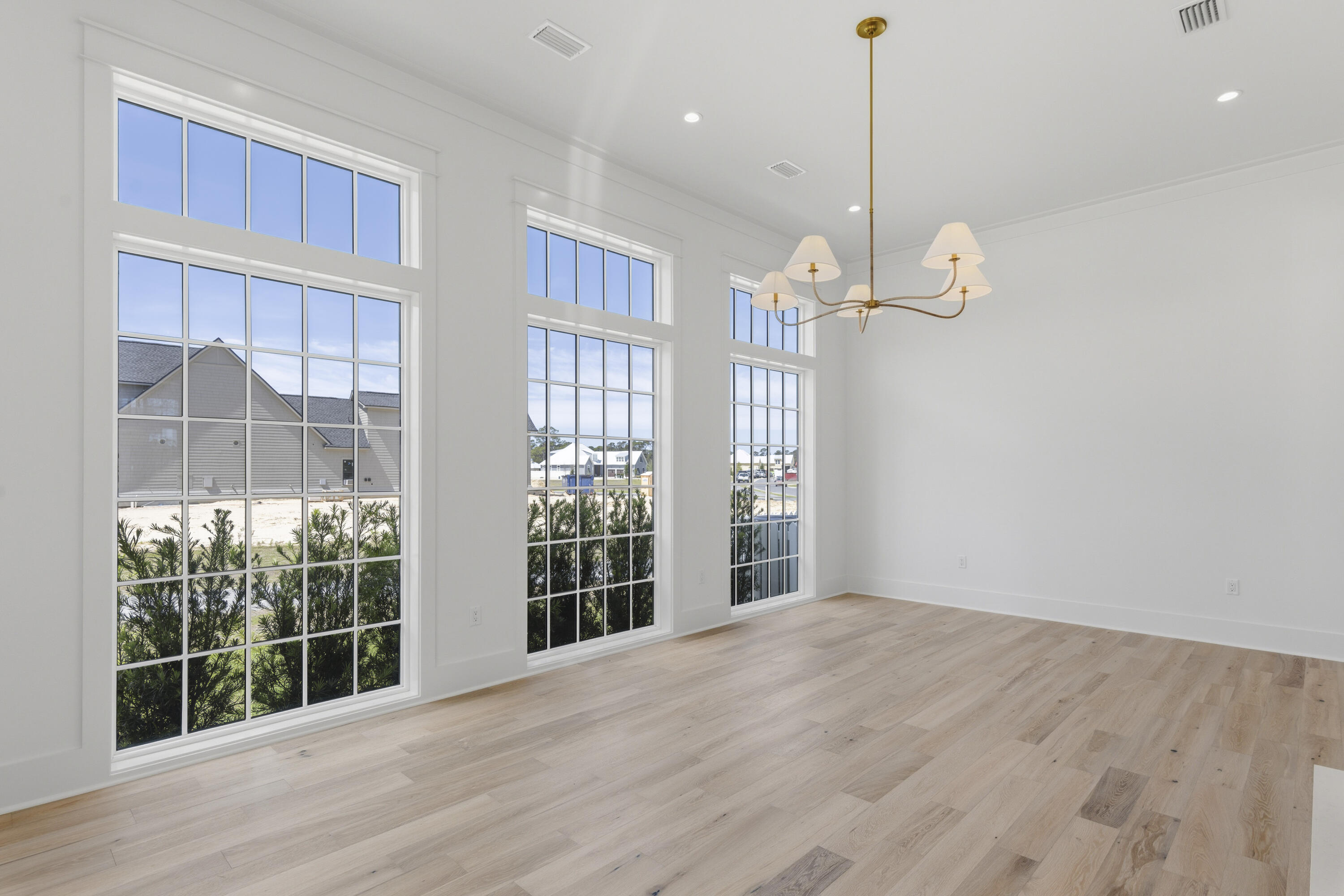 130 East Elliot Way Watersound, FL 32461 - Photo 20 of 52 a view of a room with wooden floor and windows