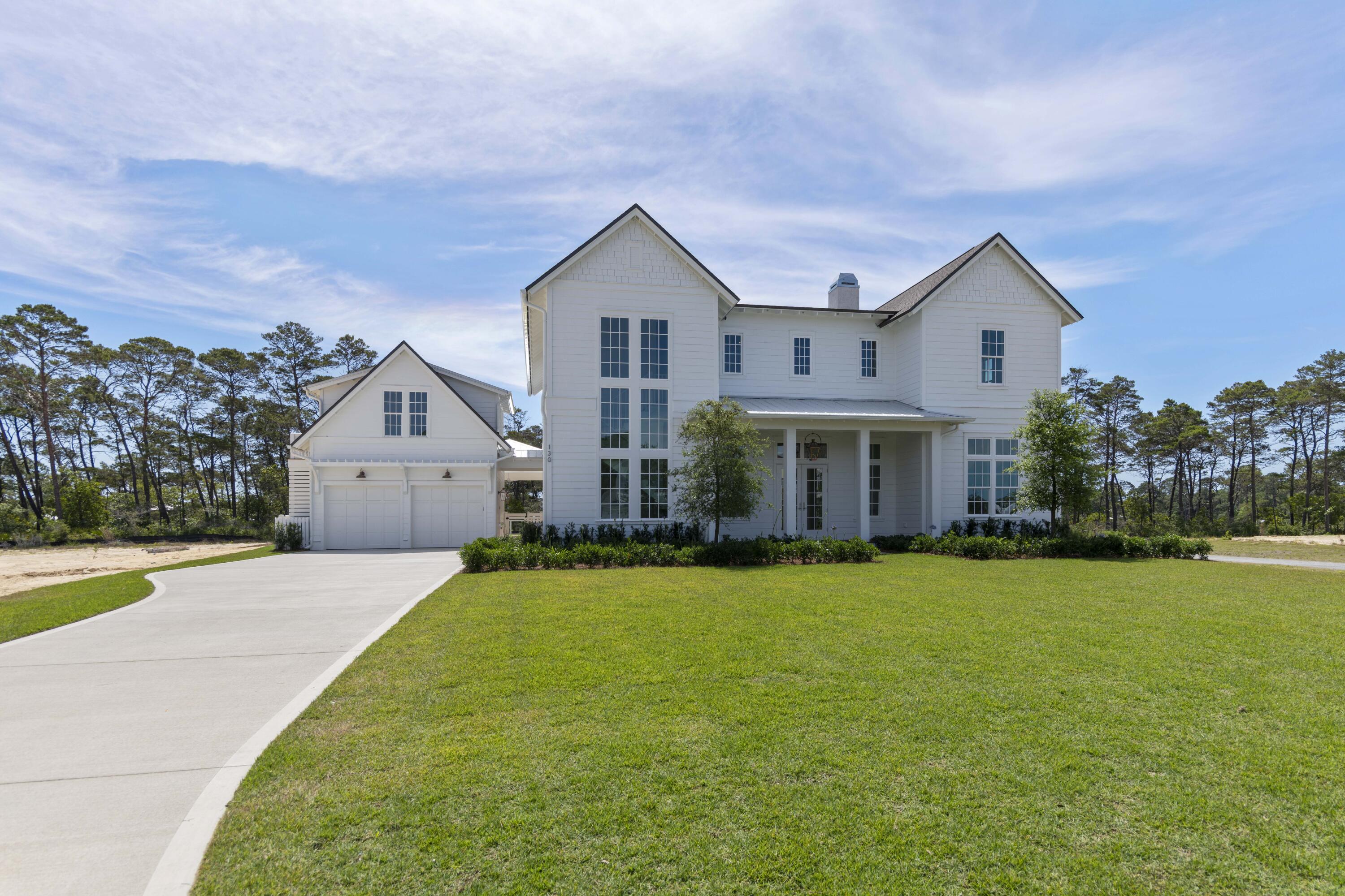 130 East Elliot Way Watersound, FL 32461 - Photo 2 of 52 a front view of house with yard and green space