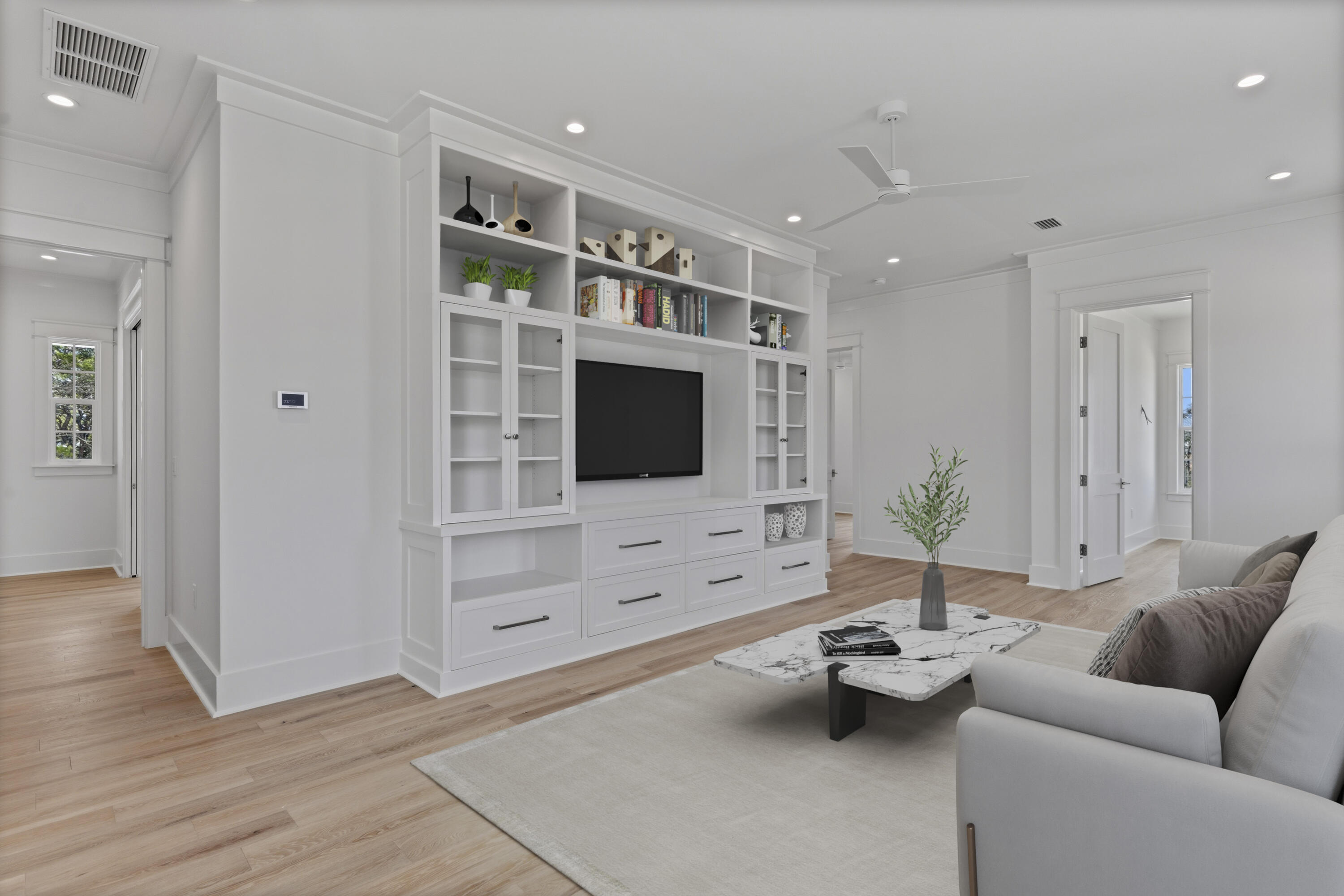 130 East Elliot Way Watersound, FL 32461 - Photo 26 of 52 a living room with furniture wooden floor and flat screen tv