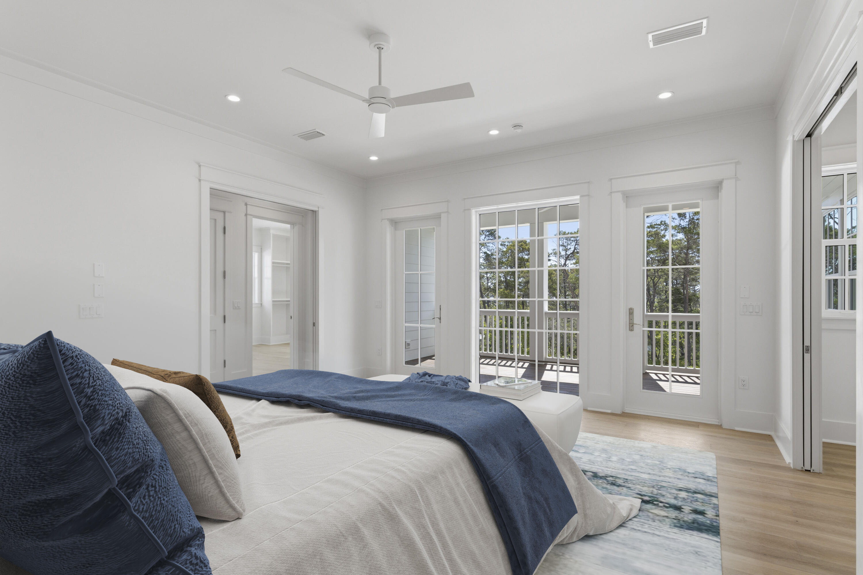 130 East Elliot Way Watersound, FL 32461 - Photo 27 of 52 a spacious bedroom with a large bed and a large window