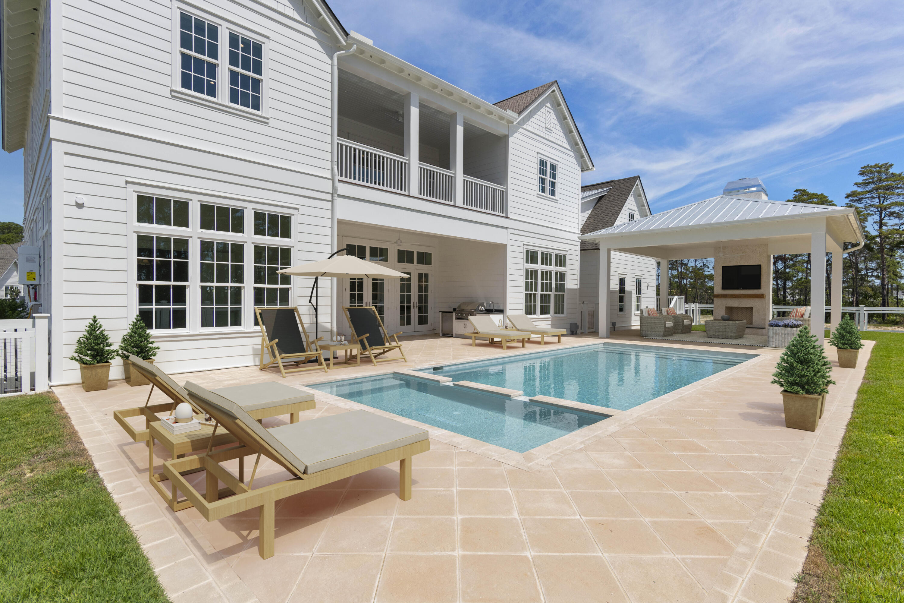 130 East Elliot Way Watersound, FL 32461 - Photo 3 of 52 a view of a house with swimming pool and sitting area