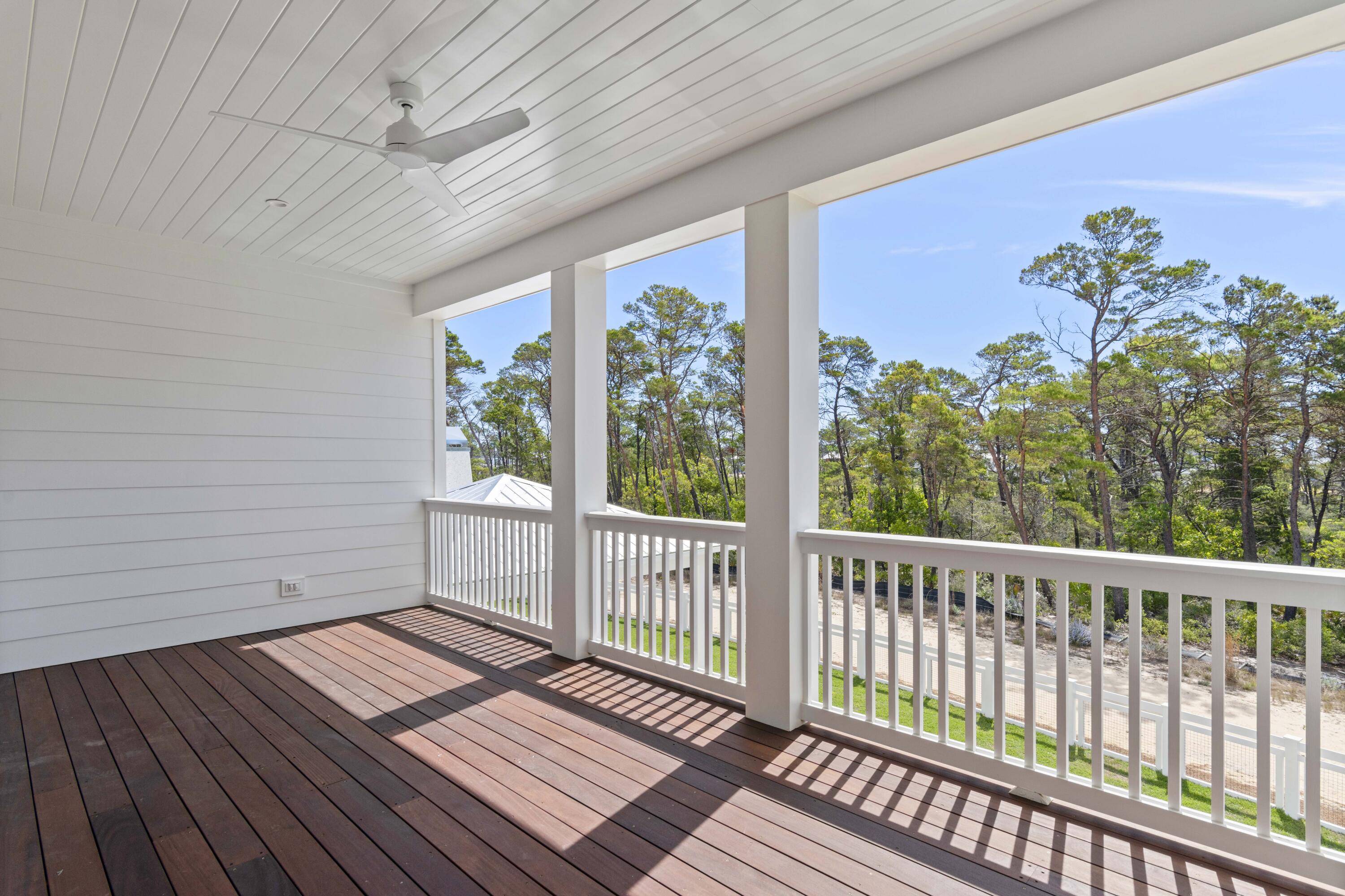 130 East Elliot Way Watersound, FL 32461 - Photo 32 of 52 a view of a balcony with wooden floor