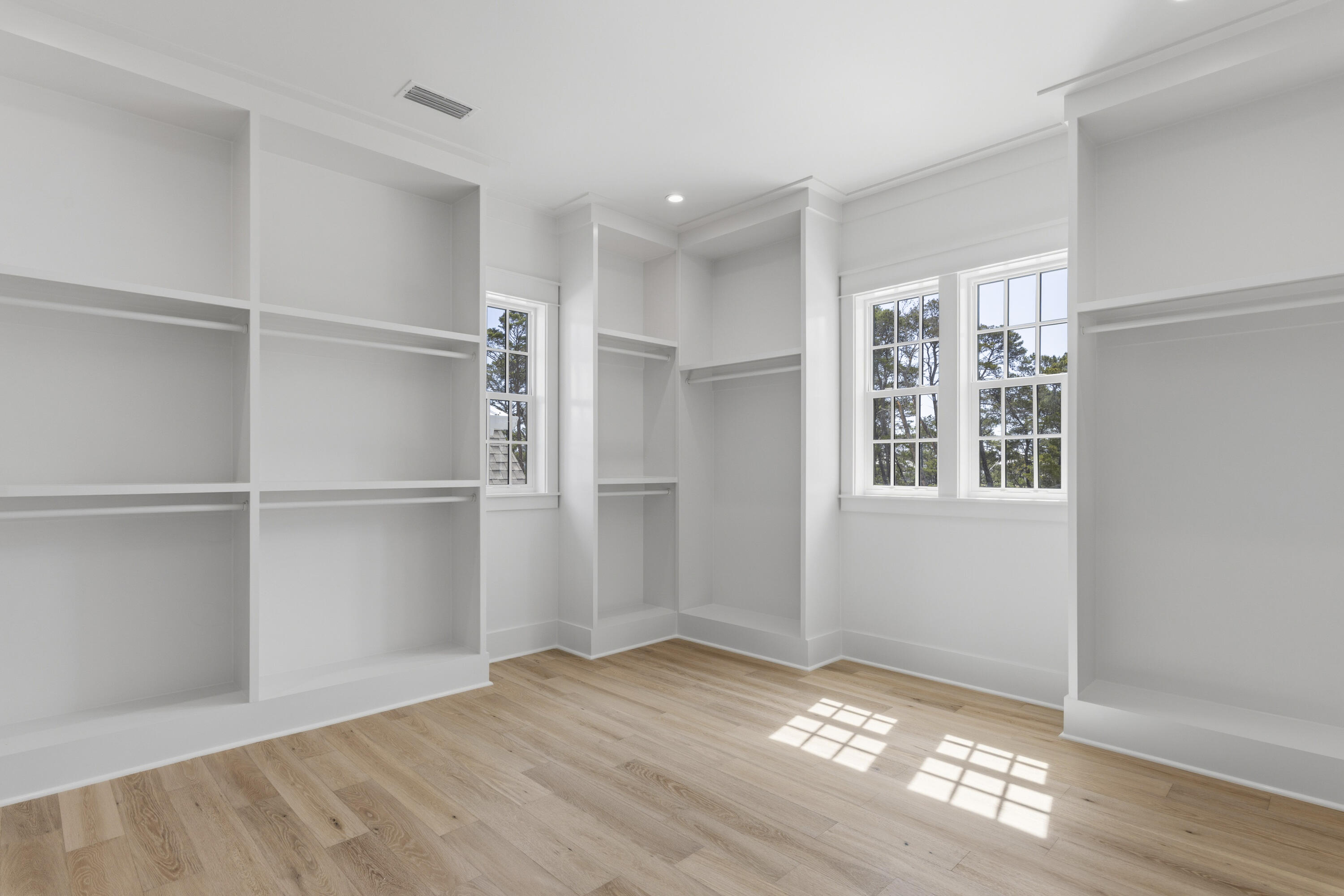 130 East Elliot Way Watersound, FL 32461 - Photo 35 of 52 a view of an empty room with window and wooden floor