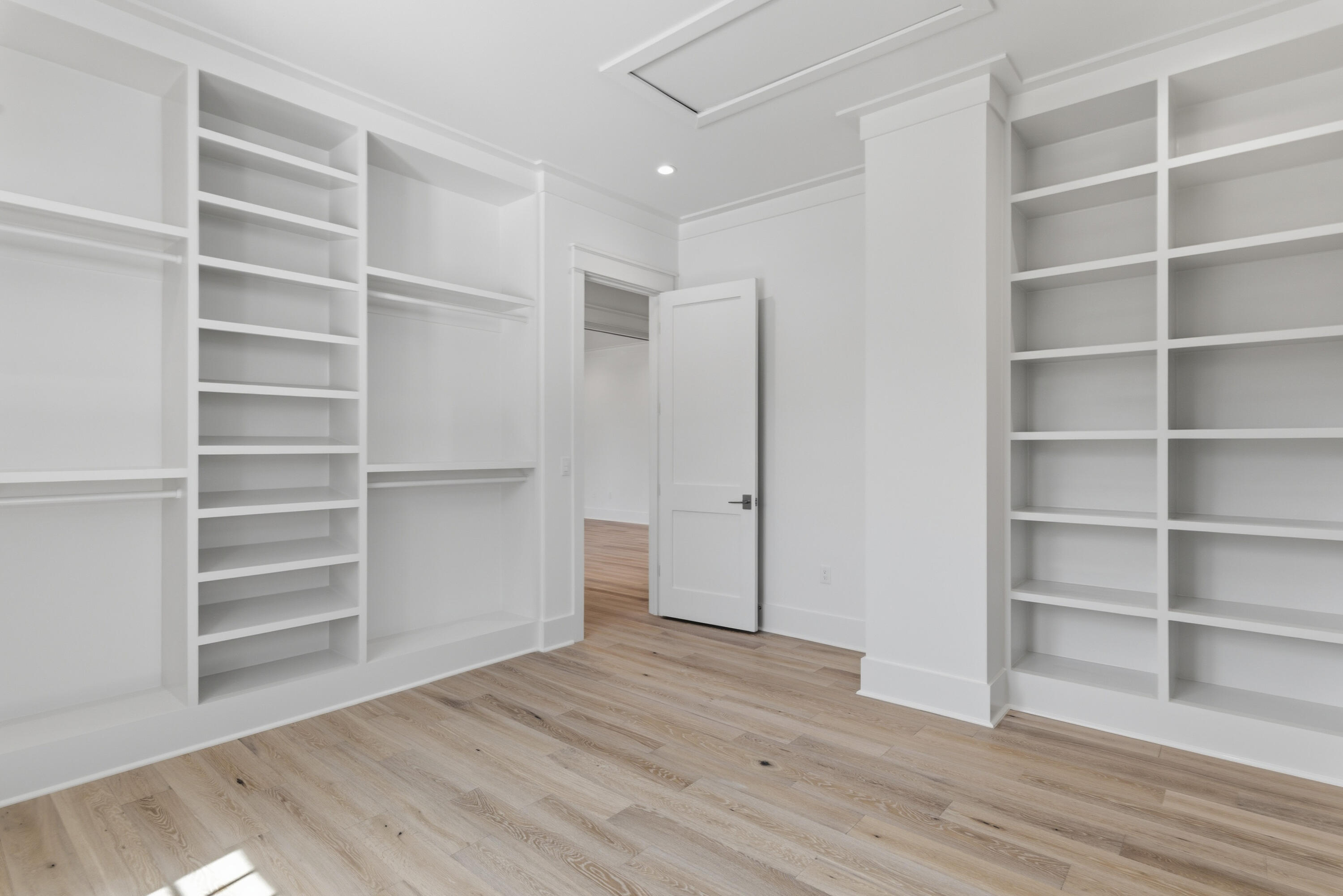 130 East Elliot Way Watersound, FL 32461 - Photo 36 of 52 a view of walk in closet with empty racks